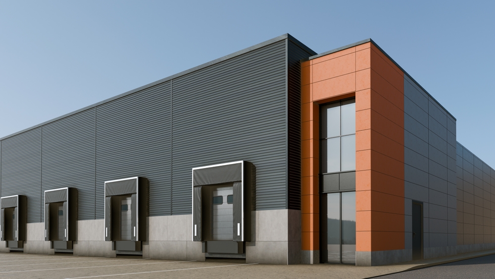 Modern industrial building with multiple loading docks and overhead doors