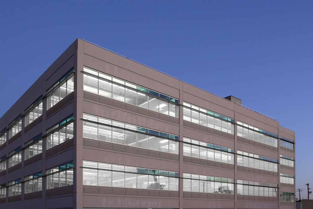 Modern multi-story professional office building with expansive exterior glazing